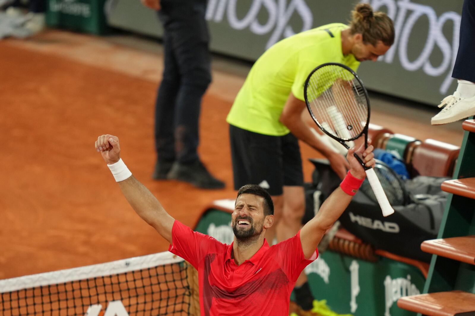 Serbia's Novak Djokovic celebrates as he won the quarterfinal match of the French Tennis Open against Germany's Alexander Zverev at the Roland-Garros stadium in Paris, Wednesday, June 4, 2025. (AP Photo/Aurelien Morissard)
