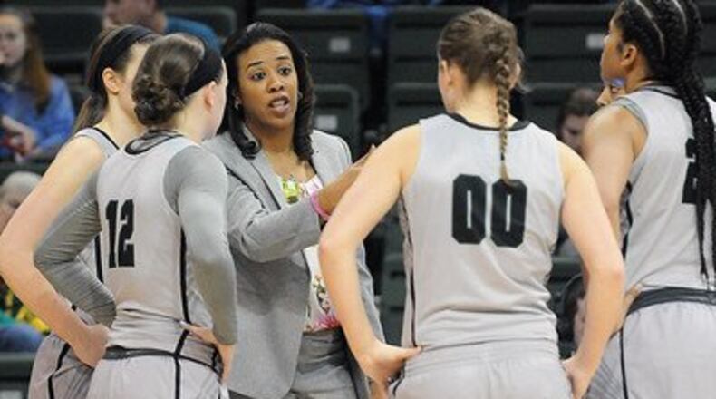 Wright State women’s basketball coach Katrina Merriweather talks to some of her players during a game earlier this season . Tim Zechar/Contributed photo