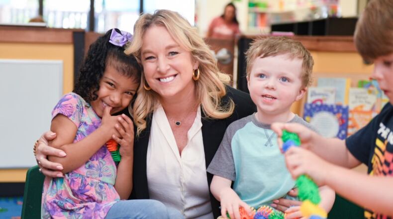 The founder of Skidaddles, Tiffany Lewis, is seen with children at the day care. It recently expanded to add a room for children age 1 year and above. Previously Skidaddles required children to be at least 18 months old. CONTRIBUTED