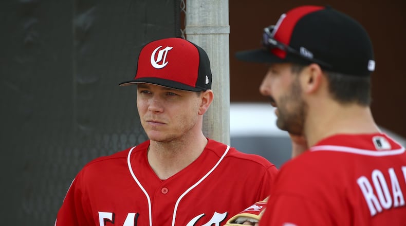 FILE - In this Feb. 13, 2019, file photo, Cincinnati Reds pitcher Sonny Gray (54) and Tanner Roark pause during workouts at the Reds spring training baseball facility, in Goodyear, Ariz. Gray agreed to a trade from the Yankees after deciding he wanted to be part of the Reds’ attempt at a resurgence. Now they have to figure out where he fits in the rotation. (AP Photo/Ross D. Franklin, File)