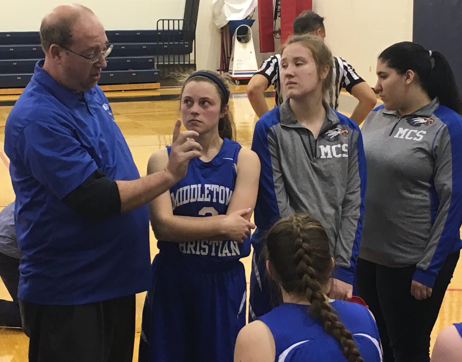 Middletown Christian coach Ken Yablonsky makes a point to his team during a timeout in Thursday night’s game against Miami Valley at Lane Gymnasium in Washington Township. RICK CASSANO/STAFF