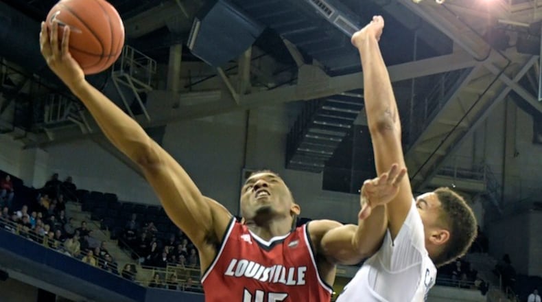 FILE - In this Jan. 24, 2017, file photo, Louisville guard Donovan Mitchell (45) goes up for a shot against Pittsburgh guard Cameron Johnson (23) during the second half of an NCAA college basketball game, in Pittsburgh. Mitchell left Louisville after his sophomore season and has the chance to be a lottery pick in Thursday's NBA draft. (AP Photo/Fred Vuich, FIle)