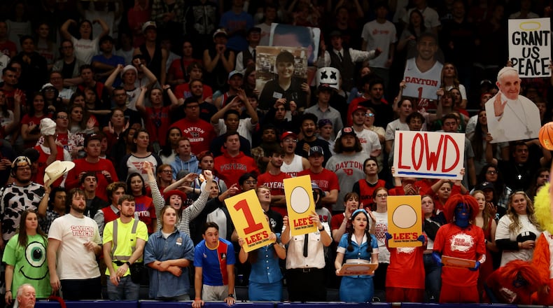 Dayton fans in the student section cheer during a game against Capital in an exhibition game on Saturday, Oct. 29, 2022, at UD Arena. David Jablonski/Staff
