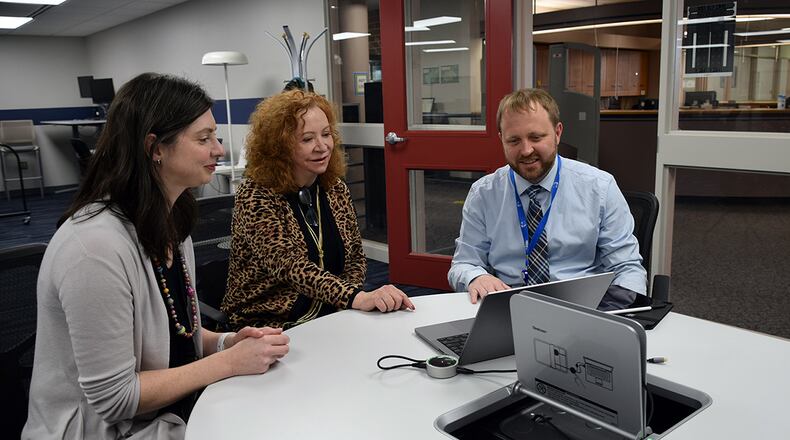 The Center for Innovation in Education at the Air Force Institute of Technology supports excellence in teaching, learning and research. Dr. Alice Grimes (center) is director of faculty development, and is aided by teammates Carolyn Stoermer, writing and communications specialist, and Jonathan Zemmer, educational technology liaison. U.S. AIR FORCE PHOTO/KATIE SCOTT