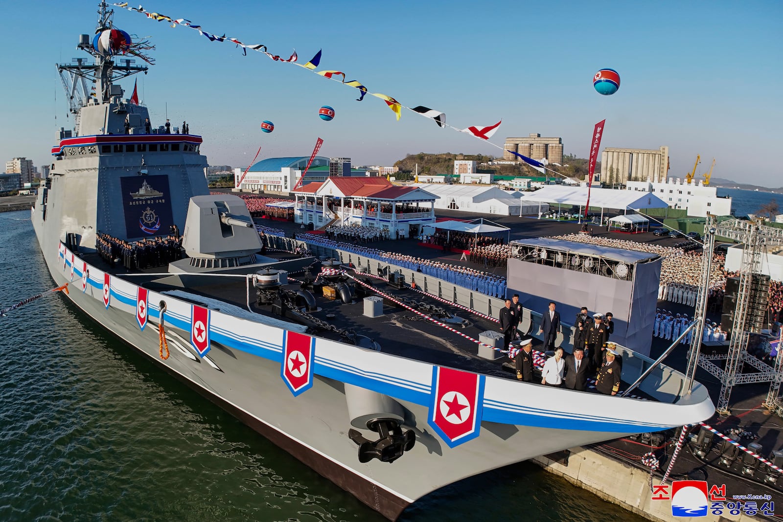 In this photo provided by the North Korean government, its leader Kim Jong Un, second right, and his daughter, third right, seen at bottom right, attend a ceremony to unveil a new naval destroyer at a western port in Nampo a launching ceremony at a western port in Nampo, North Korea, Friday, April 25, 2025. Independent journalists were not given access to cover the event depicted in this image distributed by the North Korean government. The content of this image is as provided and cannot be independently verified. Korean language watermark on image as provided by source reads: "KCNA" which is the abbreviation for Korean Central News Agency. (Korean Central News Agency/Korea News Service via AP)