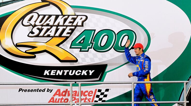 Martin Truex Jr., introduced before the start of the Quaker State 400 in 2013, is the defending race champion. NICK DAGGY / STAFF