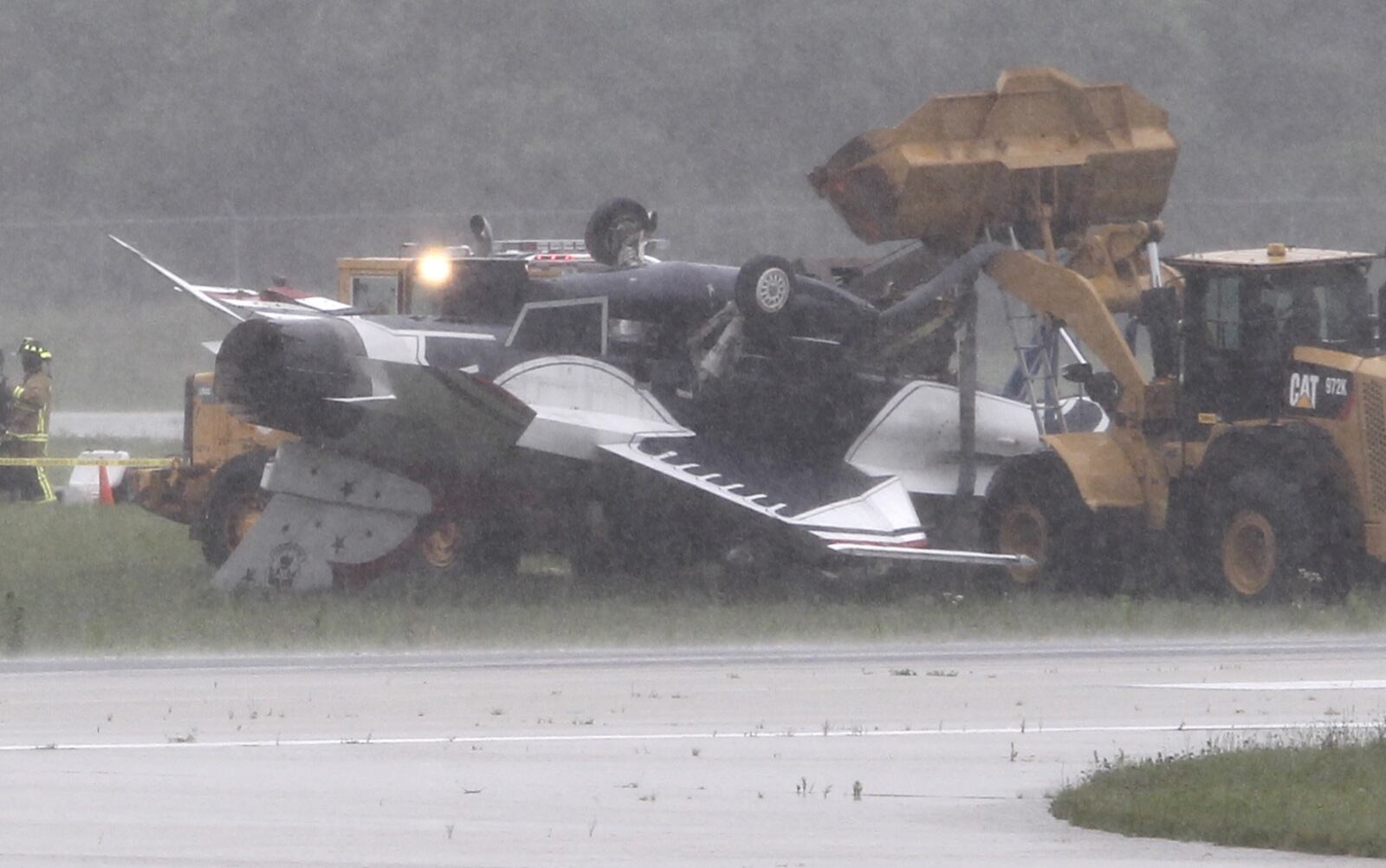 Thunderbird jet flipped over after taxiing at Dayton international airport on Friday, June 23. TY GREENLEES / STAFF