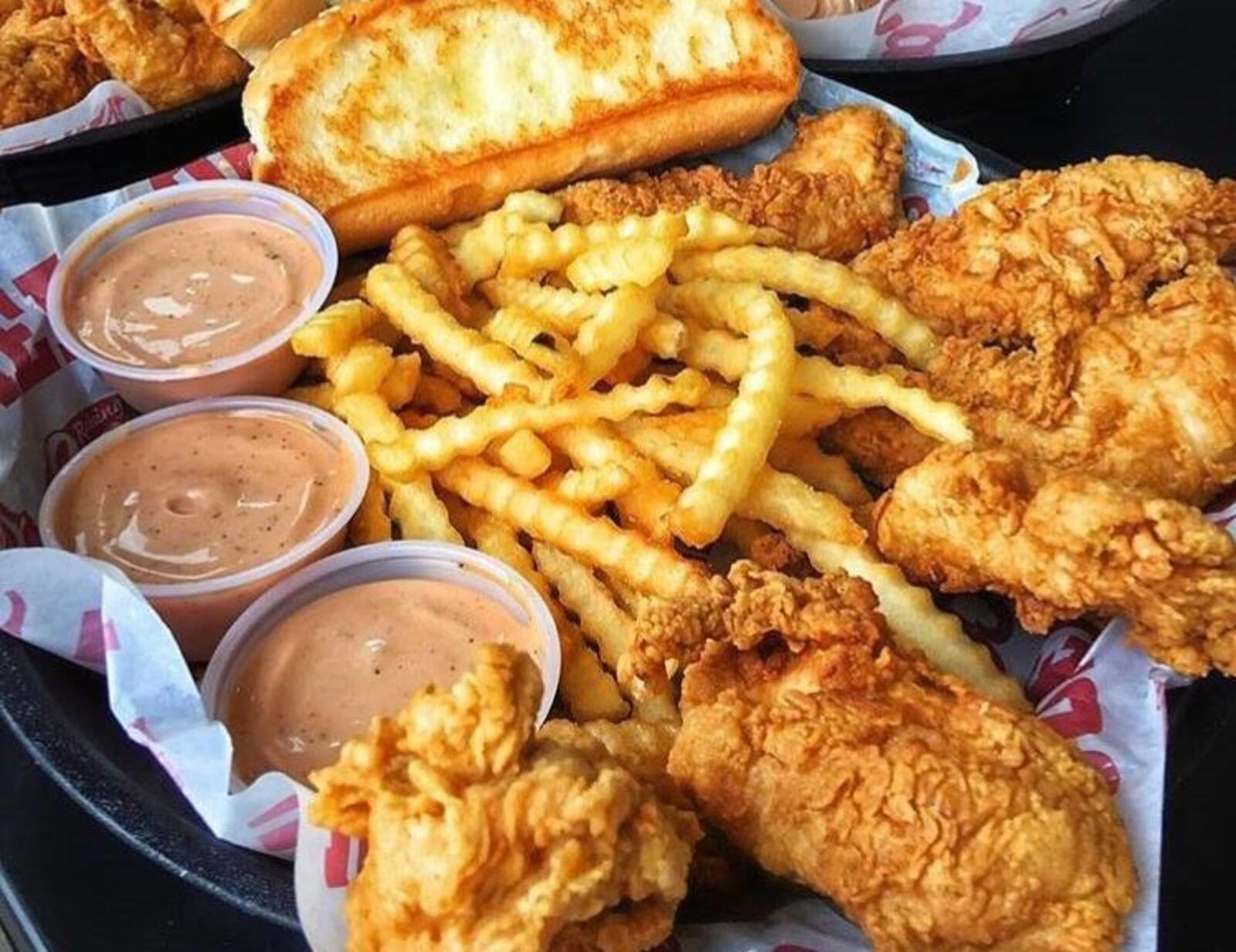 Plans are under way for a new Raising Cane’s Chicken Fingers across from The Greene. Photo from Raising Cane’s Chicken Fingers Facebook page