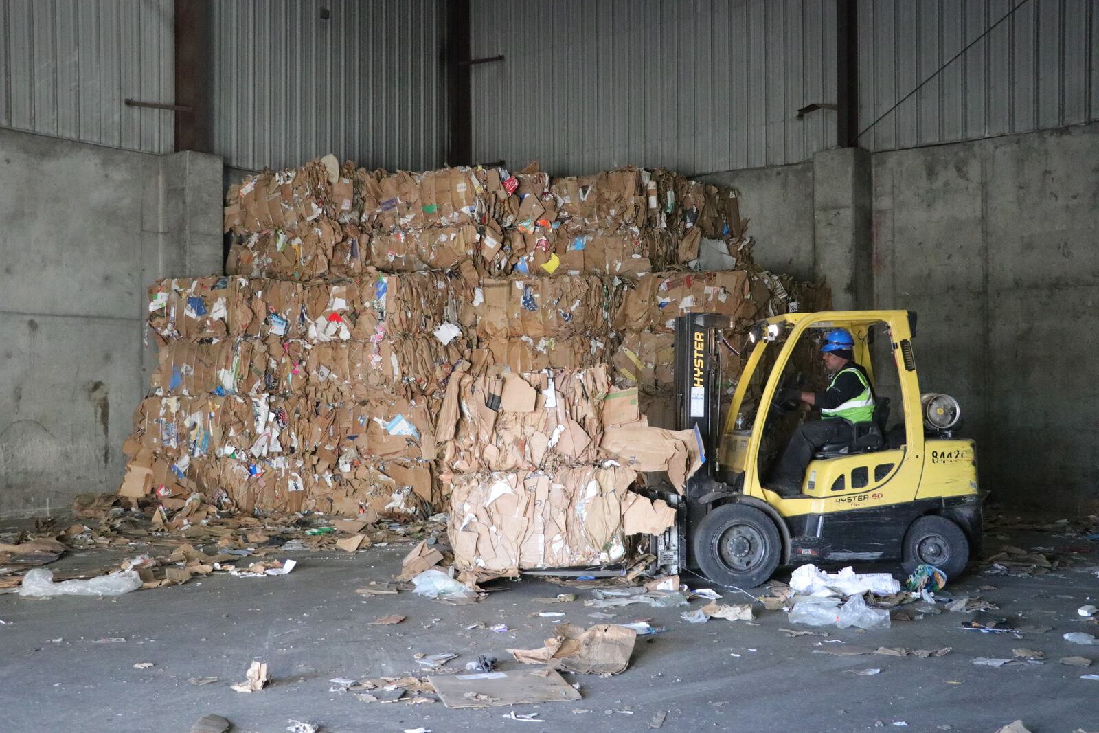 A Rumpke worker moves bales of cardboard. CONTRIBUTED