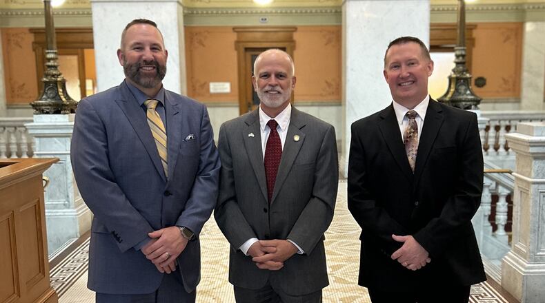 Bob Hill, superintendent of Springfield City Schools, Ohio State Senator Kyle Koehler, and Beavercreek superintendent Paul Otten pose for a photo after Hill and Otten provided testimony in the Ohio Statehouse. Photo courtesy of Beavercreek City Schools