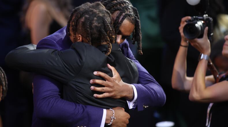 DaRon Holmes hugs his brother Cameron after being selected with the No. 22 pick in the NBA Draft on Wednesday, June 26, 2024, at the Barclays Center in Brooklyn, N.Y. David Jablonski/Staff