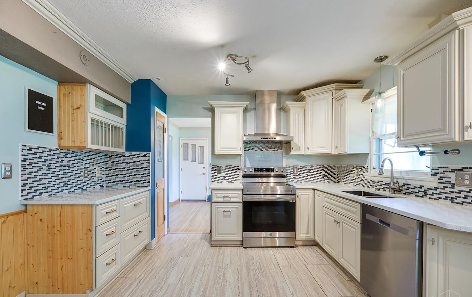 The completely updated kitchen features quartz countertops, hardwood floors, white cabinets and stainless appliances. CONTRIBUTED