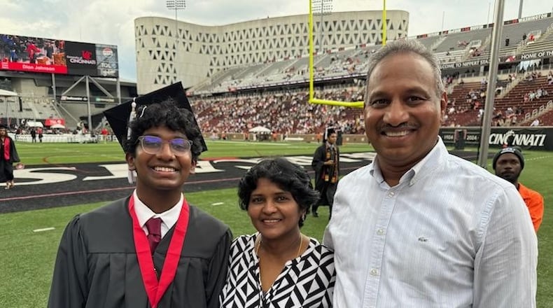 Sai Gollamudi, a University of Cincinnati and Centerville High School graduate, is shown with his parents, Rani Chadalawada and Amarnath Gollamudi during UC graduation May 2 at Nippert Stadium. CONTRIBUTED.