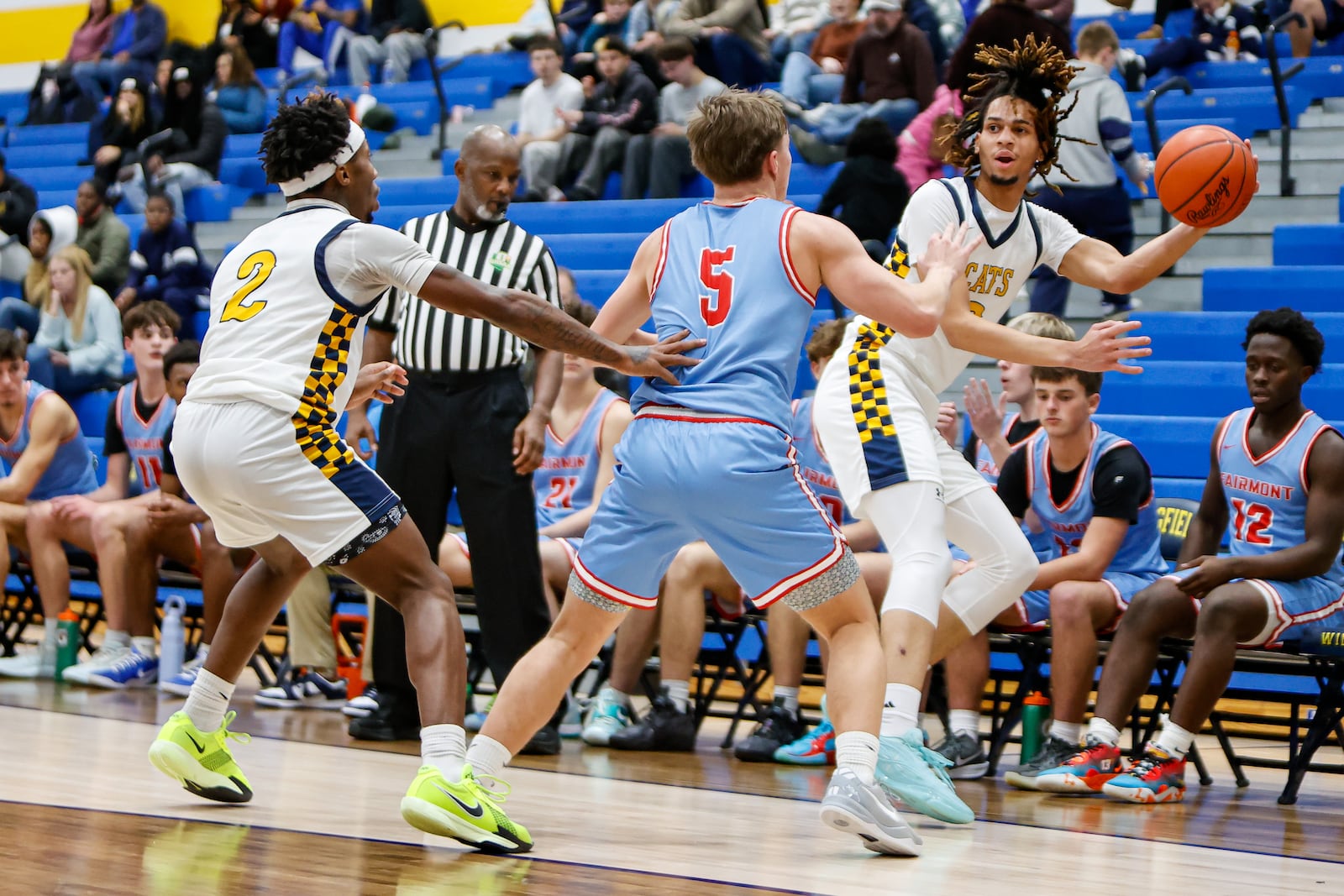 Springfield High School junior Immanuel Carey saves the ball from going out of bounds during their game against Fairmont on Tuesday, Jan. 6 at Springfield High School. The Firebirds won 54-46. MICHAEL COOPER / STAFF PHOTO