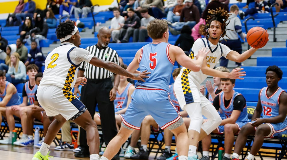 Springfield High School junior Immanuel Carey saves the ball from going out of bounds during their game against Fairmont on Tuesday, Jan. 6 at Springfield High School. The Firebirds won 54-46. MICHAEL COOPER / STAFF PHOTO