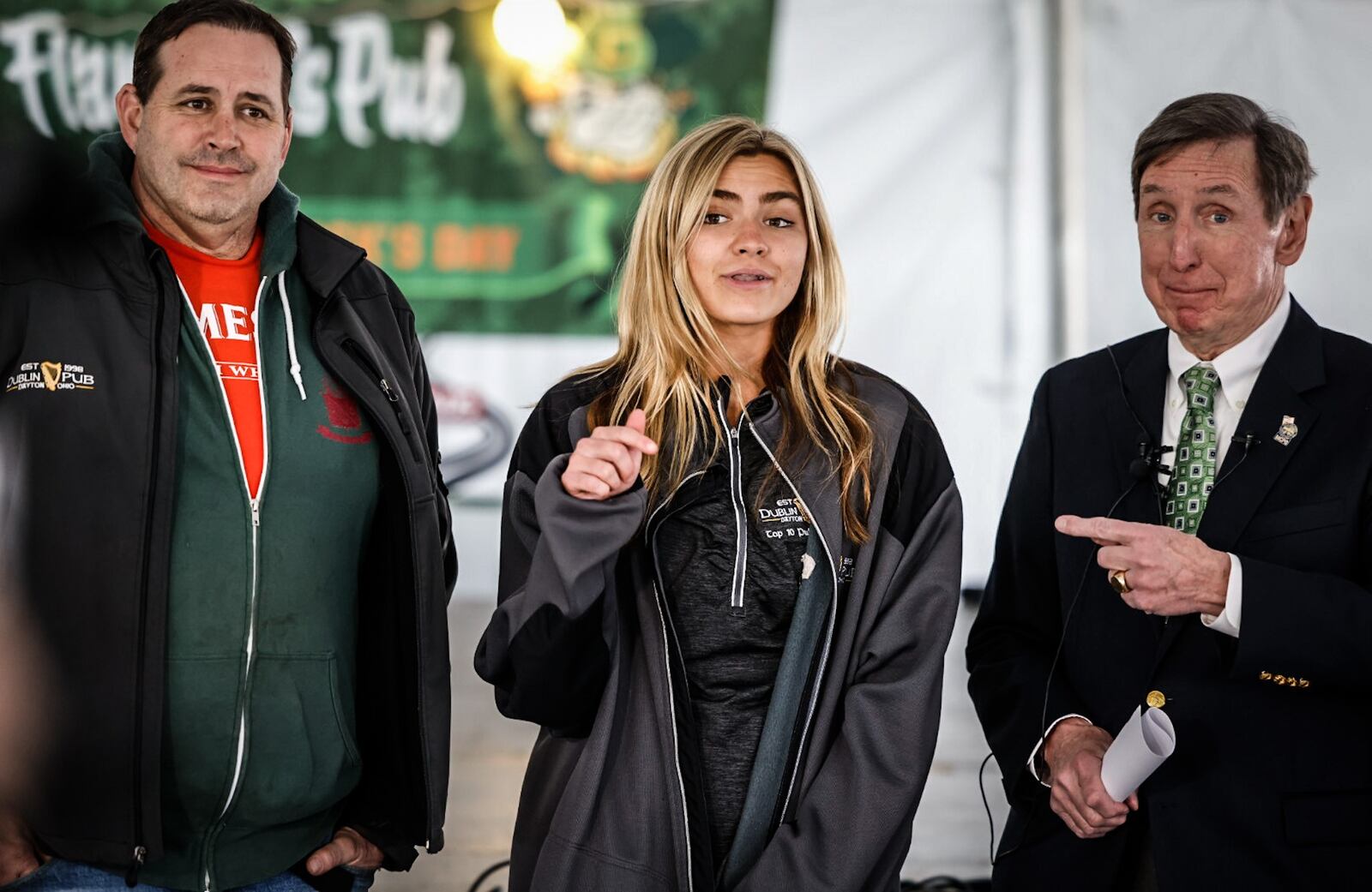 From left, Steve Tieber, Sydney Tieber and Montgomery County Prosecutor, Mat Heck Jr. held a press conference Thursday March 16, 2023 at Flannagan's Pub to discuss the Arrive Safe program for St. Patrick's Day weekend. Steve Tieber and his daughter Sydney are owners of the Dublin Pub on Wayne Ave. JIM NOELKER/STAFF
