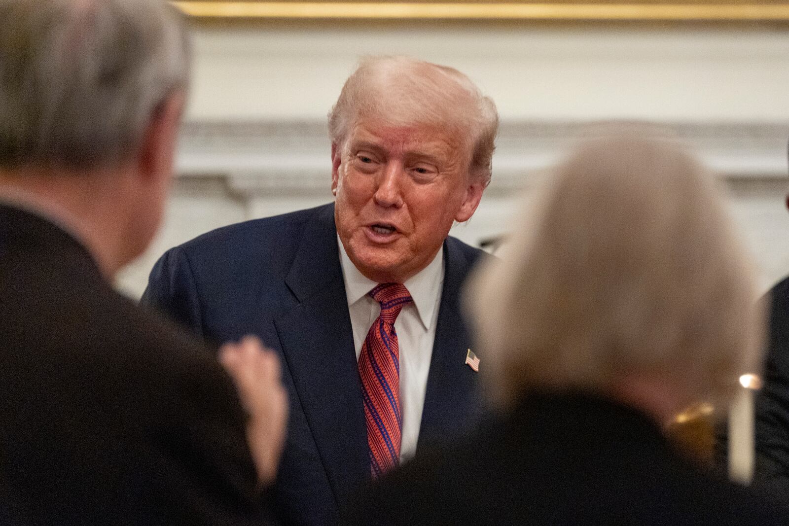 President Donald Trump greets supporters during a dinner for Republican senators in the State Dining Room of the White House, Friday, July 18, 2025, in Washington. (AP Photo/Alex Brandon)
