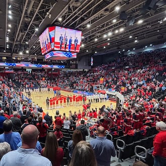Dayton and Illinois State stand for the national anthem before a game in the quarterfinals of the National Invitation Tournament on Wednesday, March 25, 2026, at UD Arena. David Jablonski/Staff