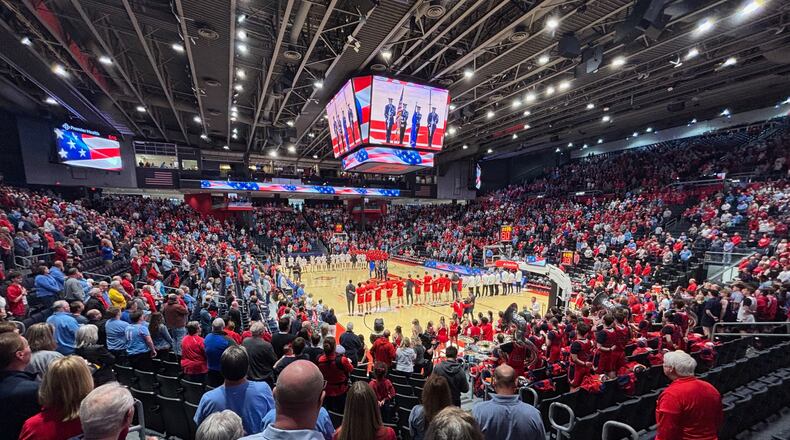 Dayton and Illinois State stand for the national anthem before a game in the quarterfinals of the National Invitation Tournament on Wednesday, March 25, 2026, at UD Arena. David Jablonski/Staff