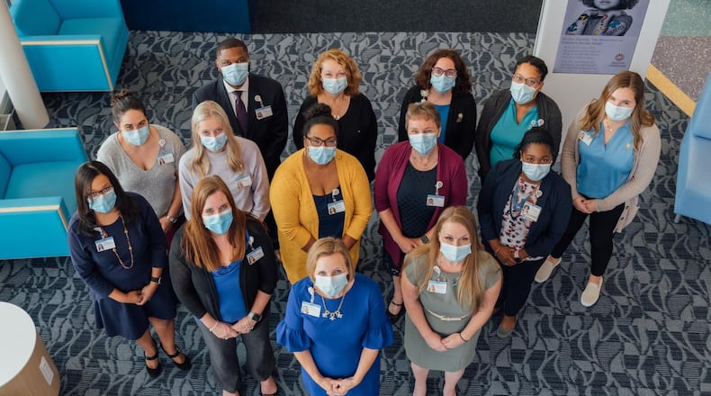 Staff with the Center for Health Equity stand in the Connor Child Health Pavilion, where the center will be based. More staff have since been hired. CONTRIBUTED