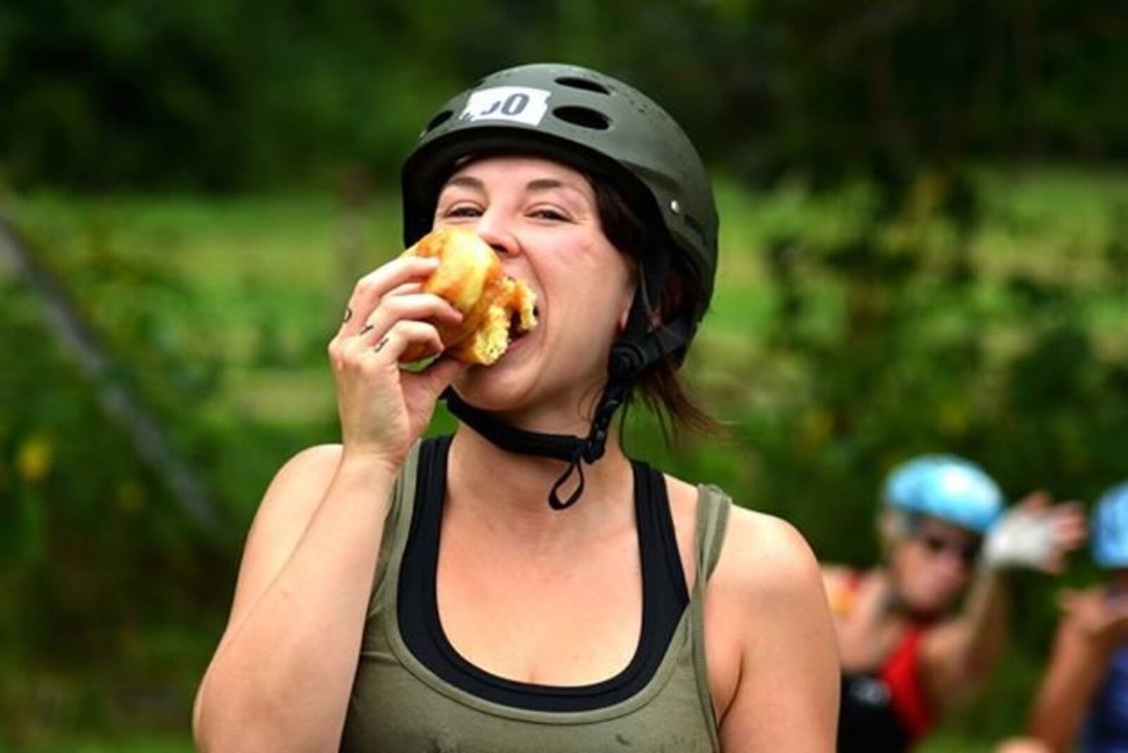A participant in a previous Tour De Donut gets into the spirit of the event by downing a donut. CONTRIBUTED