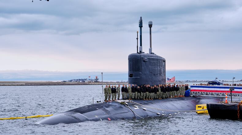 Sailors stand at attention on the USS Massachusetts during a rehearsal ahead of the commissioning of the Navy's newest nuclear-powered attack submarine, Friday, March 27, 2026, in Boston. (AP Photo/Robert F. Bukaty)