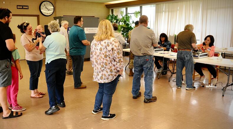 Voters wait in line to vote Tuesday, May 3, 2022 at the Dayton Korean Grace Church. MARSHALL GORBY \ STAFF
