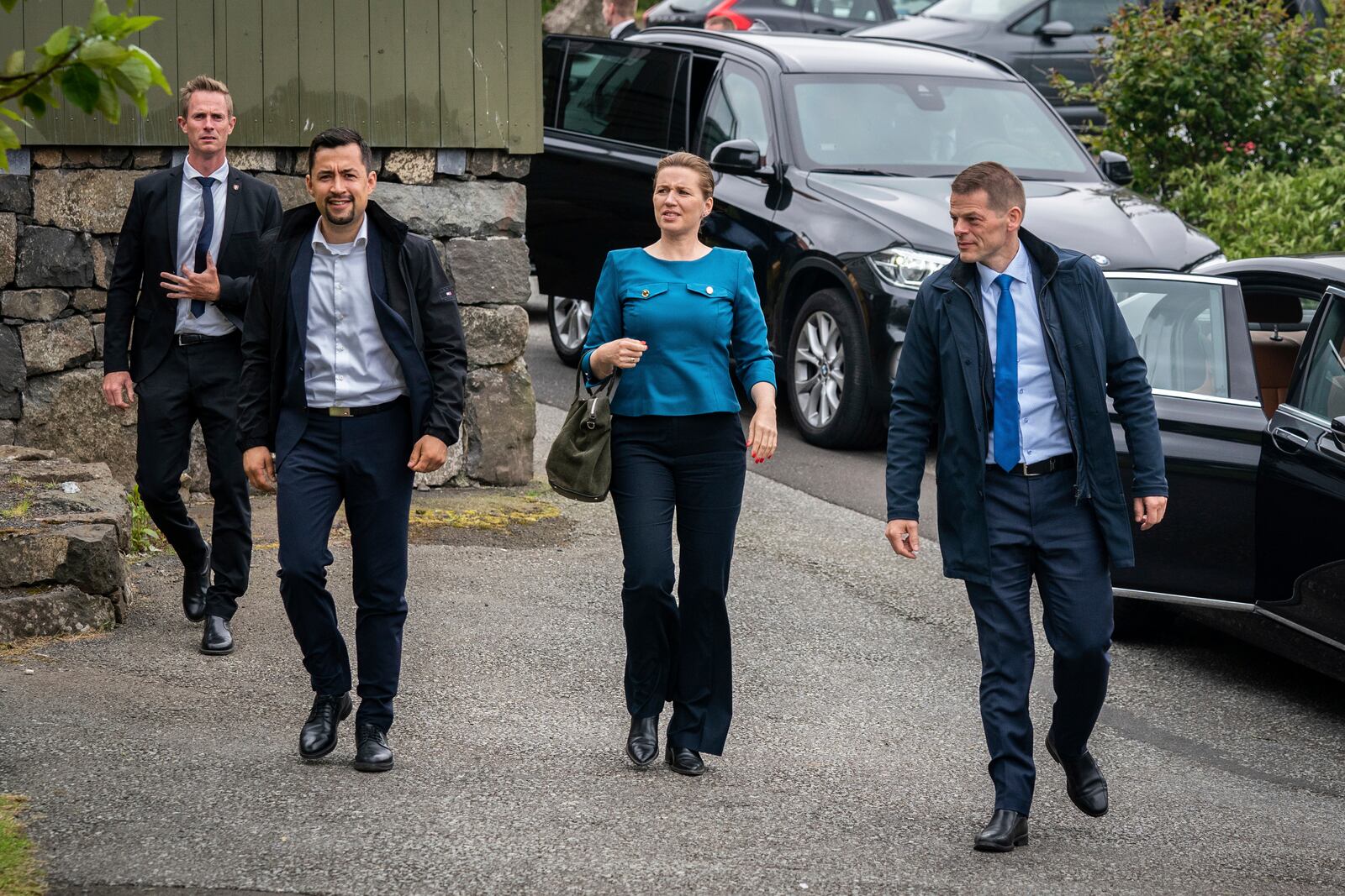 Danish Prime Minister Mette Frederiksen, center,  Faroese Lagmand Bárður á Steig Nielsen, right, and the Chairman of the Greenland Government, Múte Bourup Egede, left, arrive for a meeting of the Contact Committee in Torshavn in the Faroe Islands, Thursday June 9, 2022. (Ida Marie Odgaard/Ritzau Scanpix via AP)