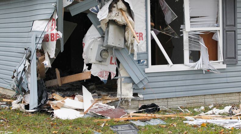 A mother and her 7-year-old son died Wednesday night, Nov. 28. 2017, after a car rammed into their house on Lilac Avenue in Dayton.