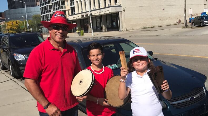Miguel Maldonado, Air Force Research Laboratory Fuels and Energy branch chief, poses with his grandchildren prior to performing at the 7th annual Hispanic Heritage Festival & Parade in Dayton Sept.16. Maldonado said he believes that mentoring, both cultural and profession, is everyone’s responsibility, but especially for those who have seen success in life. (Courtesy photo/Miguel Maldonado)