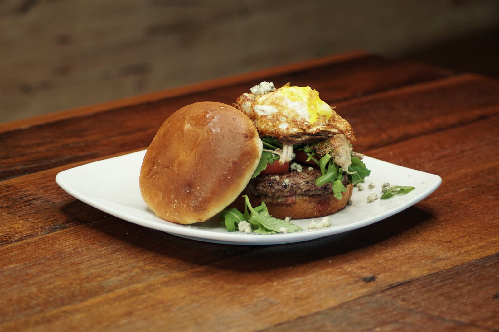 Basil's On Market's new Cobb Burger, piled high with pulled pork and a fried egg. CONTRIBUTED