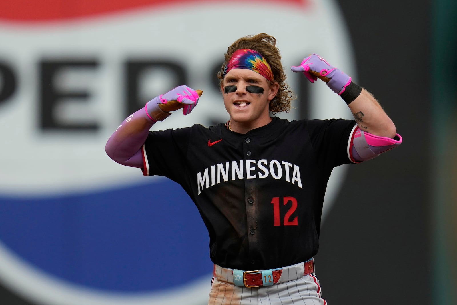 Minnesota Twins' Harrison Bader gestures at second base after hitting a double in the eighth inning of a baseball game against the Cleveland Guardians in Cleveland, Thursday, May 1, 2025. (AP Photo/Sue Ogrocki)