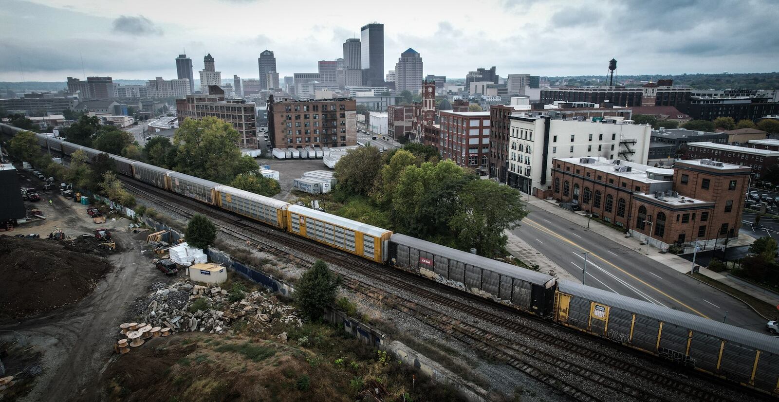 A freight train moves through Dayton near East Third Street September29, 2023. JIM NOELKER/STAFF