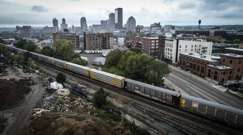 A freight train moves through Dayton near East Third Street September29, 2023. JIM NOELKER/STAFF