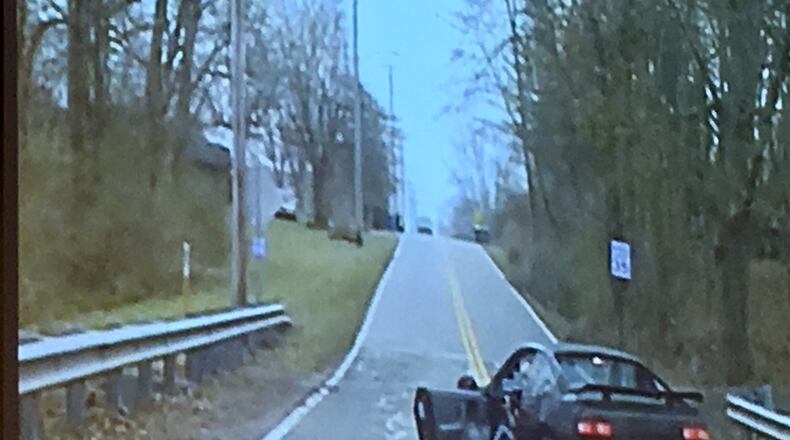 Police cruiser camera footage from a confrontation with Aaron Mitchell, who is being held on charges related to shots fired at the Clay Twp. administration building and a chase.