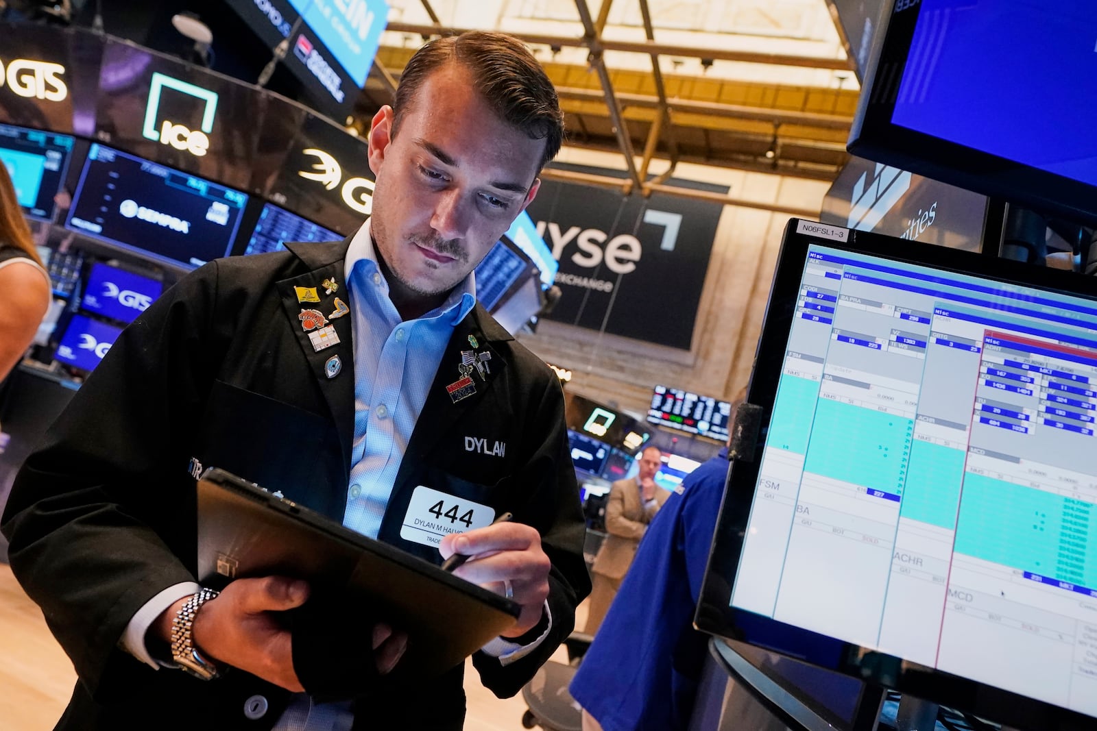 Dylan Halvorsan works on the floor of the New York Stock Exchange, Tuesday, May 27, 2025. (AP Photo/Richard Drew)