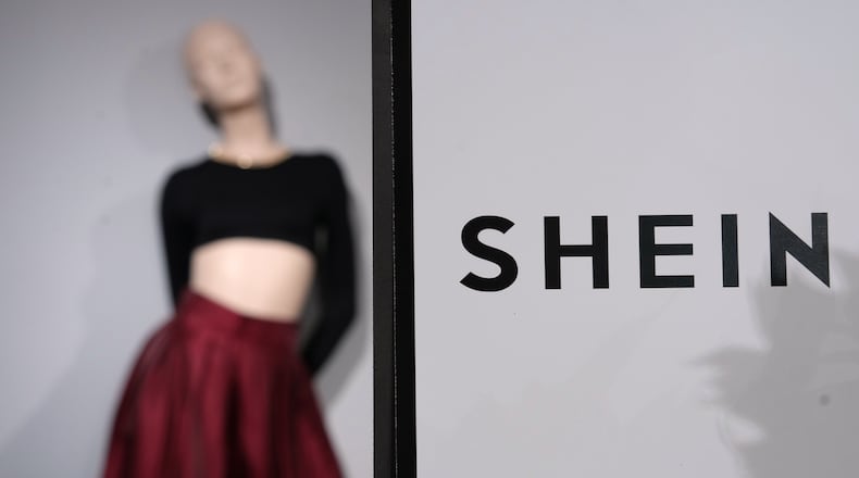 FILE - Clothes by Chinese company Shein are seen in the BHV (Bazar de l'Hotel de Ville) department store, Tuesday, Nov. 4, 2025 in Paris. (AP Photo/Aurelien Morissard, File)