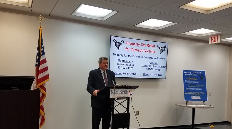 Montgomery County Auditor Karl Keith explains the application process to update taxable values of buildings damaged by Memorial Day tornadoes. STAFF PHOTO / HOLLY SHIVELY