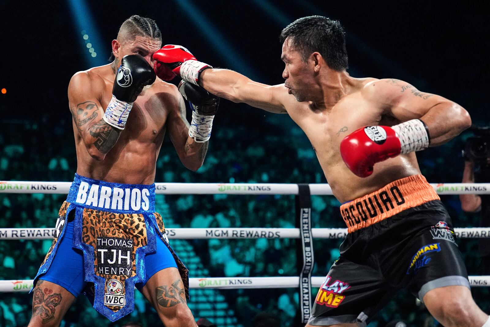 Mario Barrios, left, fights Manny Pacquiao in a welterweight title boxing match Saturday, July 19, 2025, in Las Vegas. (AP Photo/John Locher)