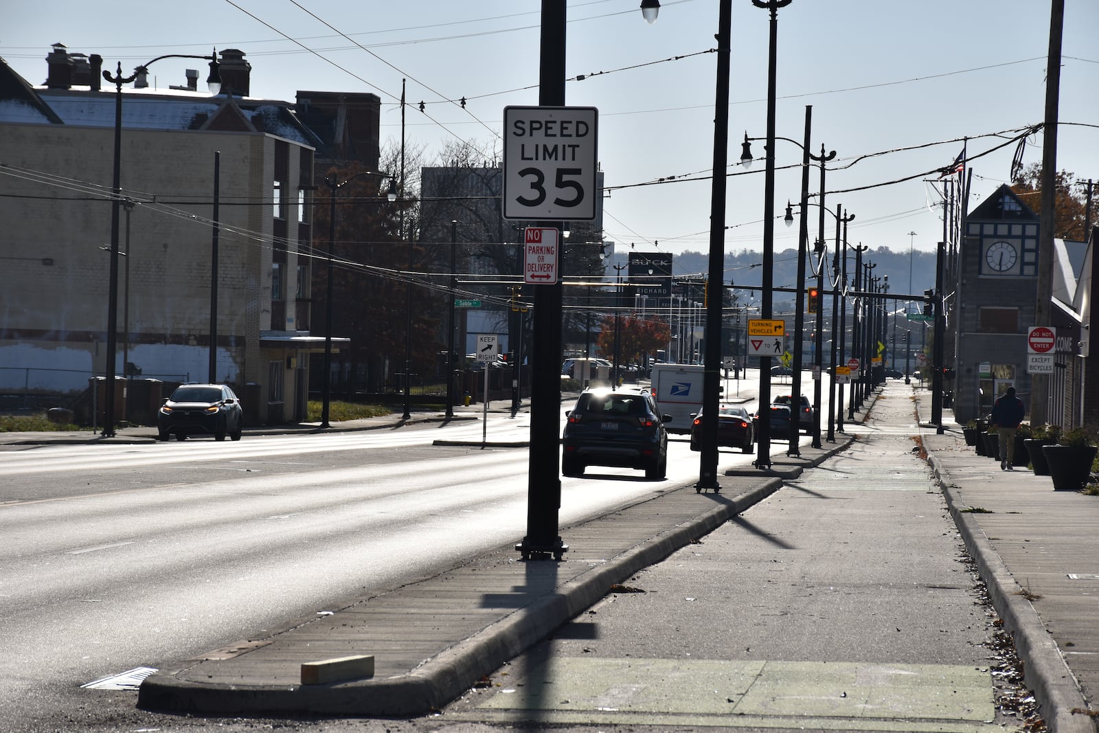 Cars drive along lower Salem Avenue in northwest Dayton. Salem Avenue has a 35 mph posted speed limit. The city of Dayton is going to evaluate lowering the speed limits in some business districts. CORNELIUS FROLIK / STAFF