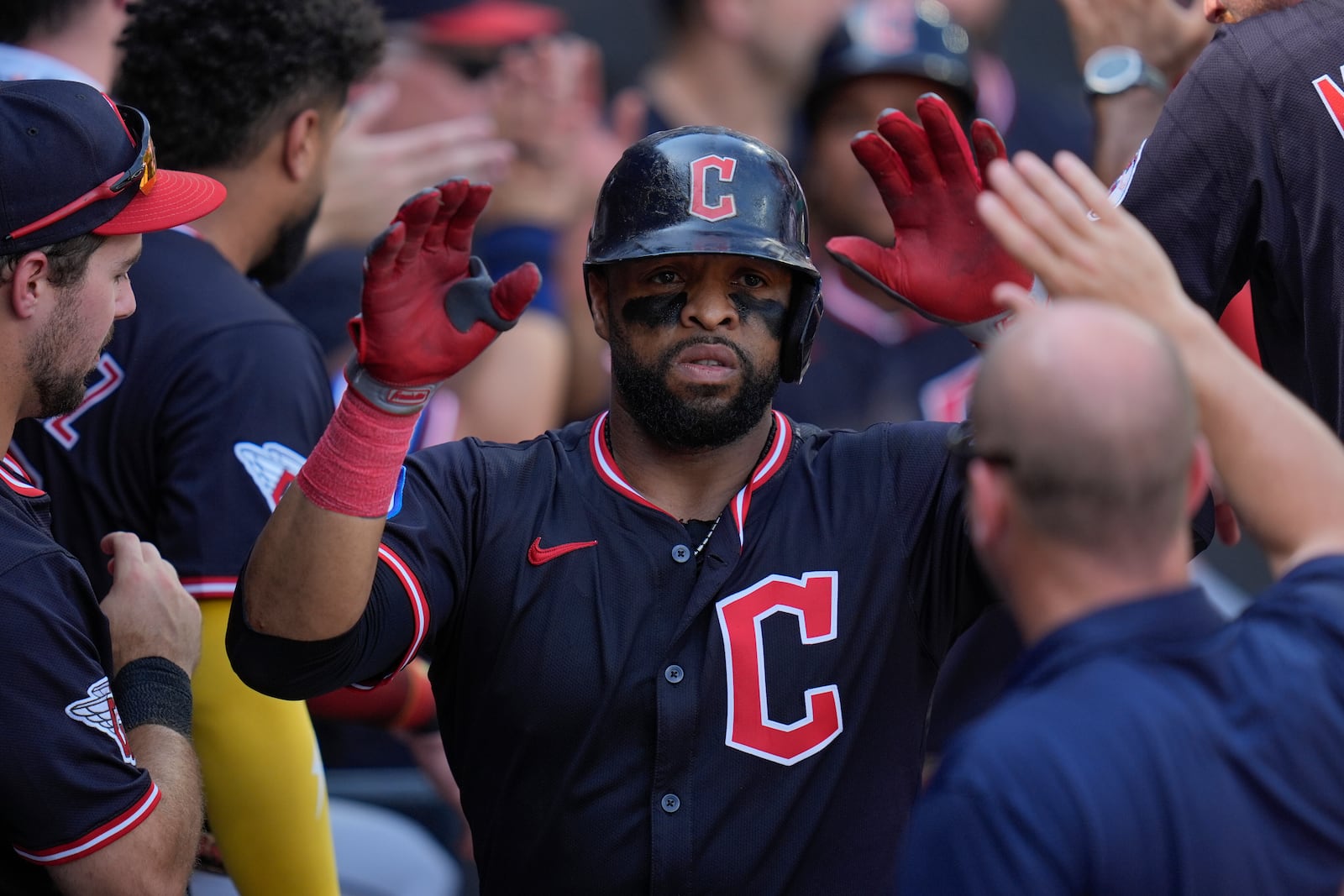 Cleveland Guardians' Carlos Santana celebrates after hitting a two-run home run during the sixth inning of the first baseball game of a doubleheader against the Chicago White Sox, Friday, July 11, 2025, in Chicago. (AP Photo/Erin Hooley)