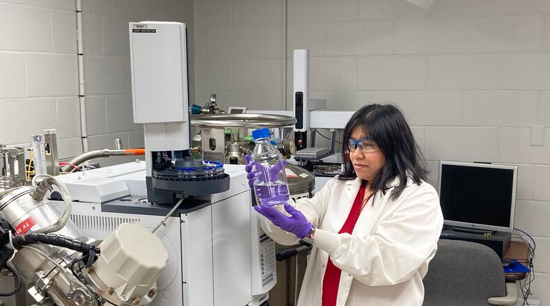 University of Dayton chemical engineer Jhoanna Alger examines aviation fuel in the lab. UD photo