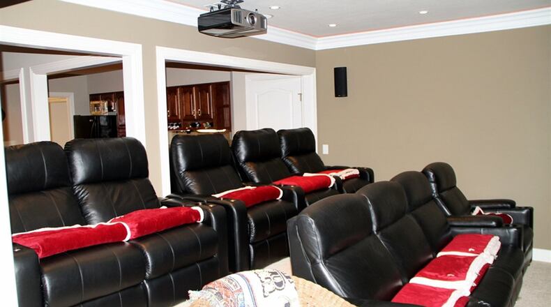 The lower-level’s theater provides a large wall screen, overhead projector and a tiered seating area.