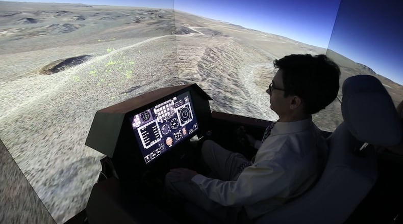 The Air Force Research Laboratory and its local allies are looking for new ways to connect to Dayton-area small businesses. In this 2015 photo, a flight simulator at Wright-Patterson Air Force Base is being used to test a mid-air collision avoidance system. TY GREENLEES / STAFF