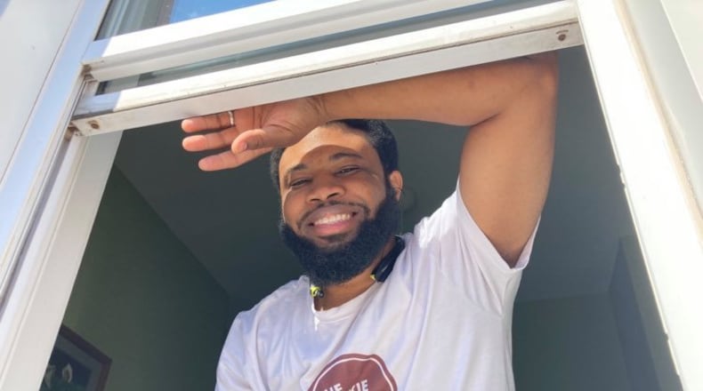 Isiah Davis bakes inside Butter Cafe on Brown St. in Dayton, and serves the cookies, fresh-baked and still hot, from the restaurant's carryout window. SARAH FRANKS/DAYTON DAILY NEWS