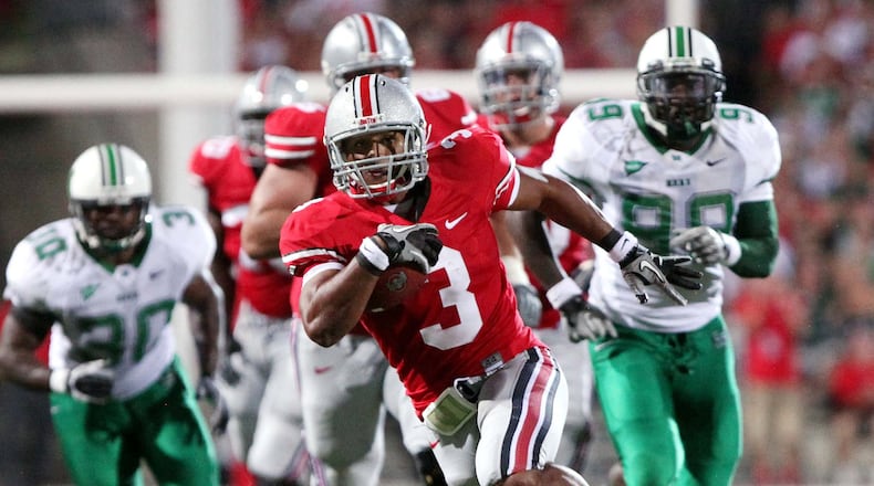 Ohio State running back Brandon Saine (3) runs in for a touchdown during the first half of an NCAA college football game against Marshall, Thursday, Sept 2, 2010, in Columbus, Ohio. (AP Photo/Terry Gilliam)