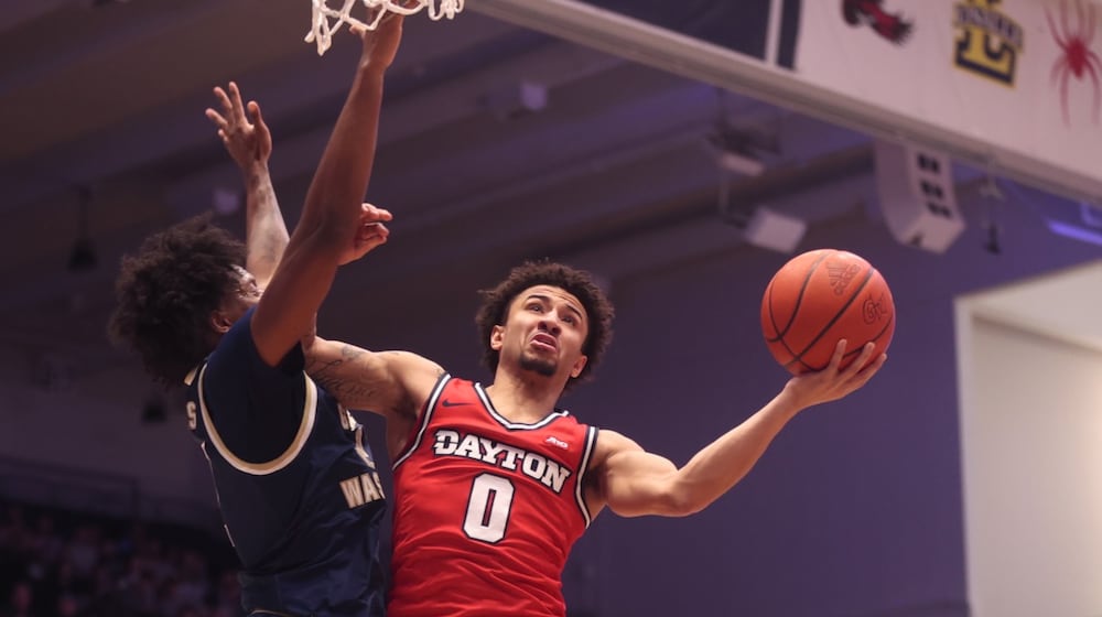 Dayton's Javon Bennett shoots against George Washington on Friday, Feb. 27, 2026, at the Charles E. Smith Center in Washington, D.C. David Jablonski/Staff