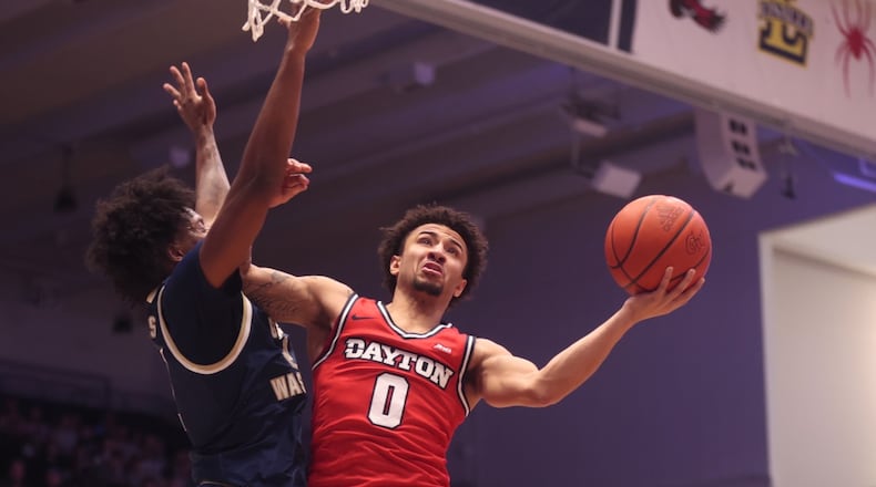 Dayton's Javon Bennett shoots against George Washington on Friday, Feb. 27, 2026, at the Charles E. Smith Center in Washington, D.C. David Jablonski/Staff