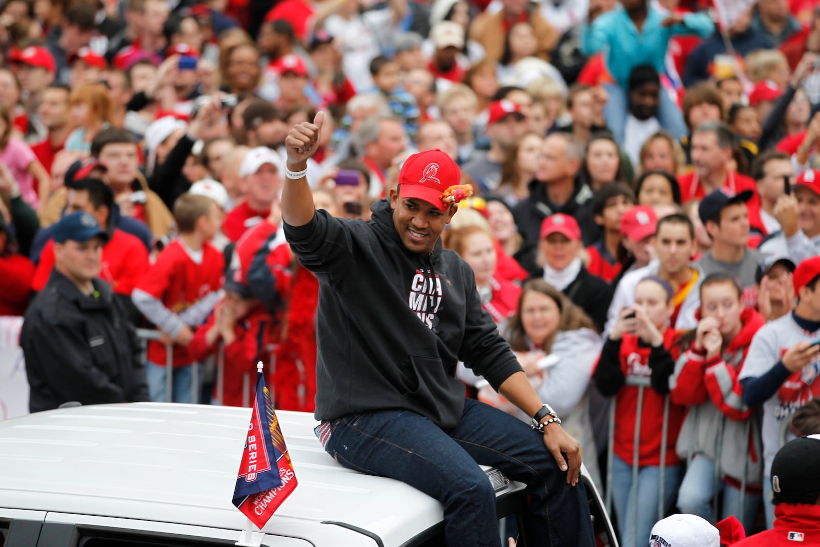 FILE - St. Louis Cardinals relief pitcher Octavio Dotel participates in a victory parade after defeating the Texas Rangers to win their 11th World Series in franchise history Sunday, Oct. 30, 2011, in St. Louis. (AP Photo/Jeff Roberson, File)