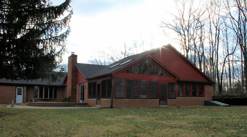 The 3-season room is accessible from the great room and the main bedroom. The room has a cathedral ceiling with 2 skylights. The great room has 2 sets of patio doors that open to a deck and stamped concrete patio.